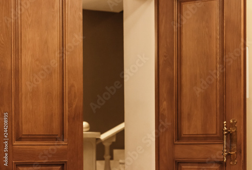 Hall with opened doors. Wooden big doors in theater or museum