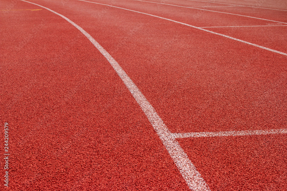 Red running track Synthetic rubber on the athletic stadium.