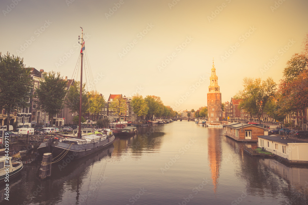 Typical view of canal embankment in historic center of city, Amsterdam, Netherlands.