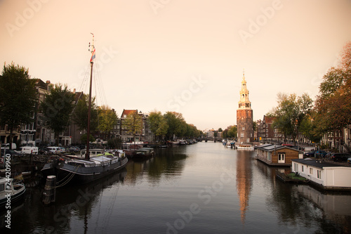 Typical view of canal embankment in historic center of city, Amsterdam, Netherlands.