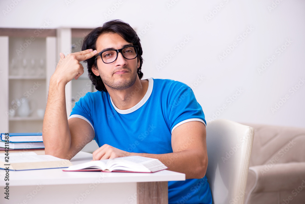 Young handsome student studying at home Young handsome student studying at home