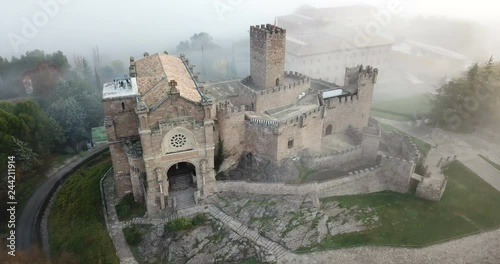 Aerial view of impressive medieval castle of Xavier with attached Basilica on hill in town of Javier, Navarre, Spain photo