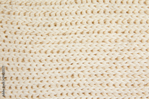 White knitted woolen fabric textile background. Horizontal lines.