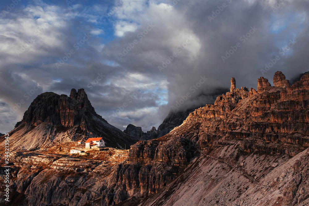 The whims of nature creates unbelievable spectacle. Touristic buildings waiting for the people who wants goes through these amazing dolomite mountains
