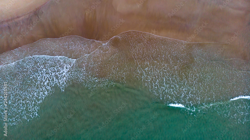 Beautiful aerial view of a beach with waves