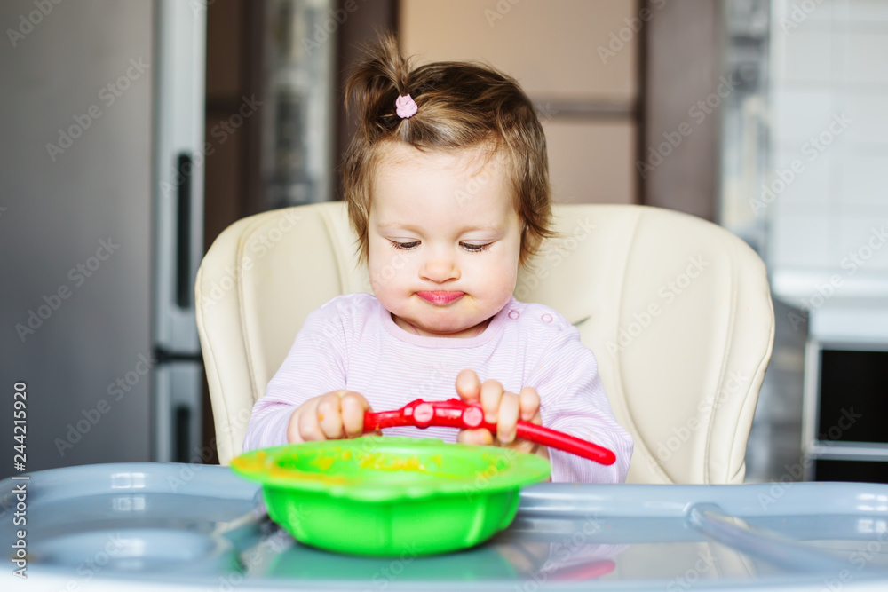 funny little baby eating vegetable puree funny little baby eating vegetable puree