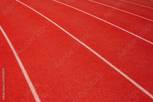 Red running track Synthetic rubber on the athletic stadium.