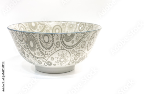 blue pattern of Turkish cucumber on a white plate bowl on white background