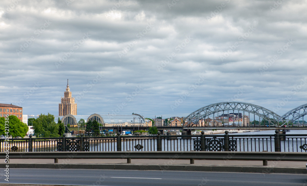 View on Railway Bridge over Daugava River and the building of the Academy of Sciences in Riga, Latvia