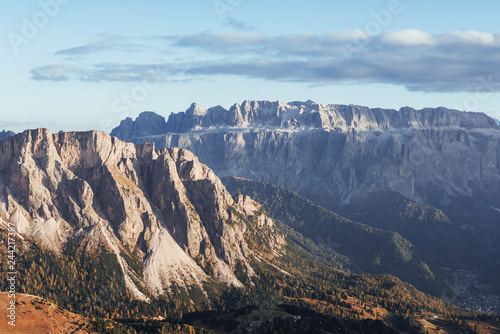 Landscape of mountains and trees below at sunny day. Italian Seceda alpes