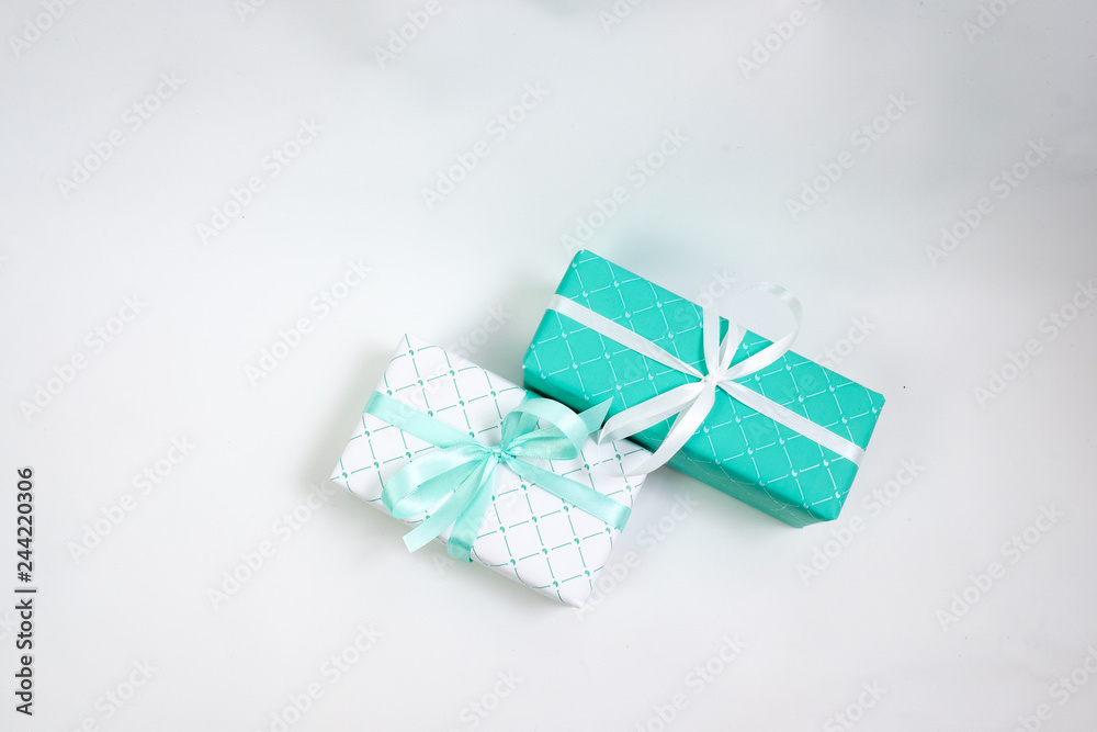 Green and white gift boxes with ribbons isolated on white background, holidays Green and white gift boxes with ribbons isolated on white background, holidays