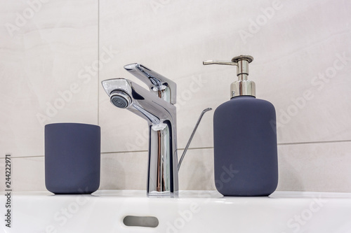 Water tap sink with faucet in expensive loft kitchen