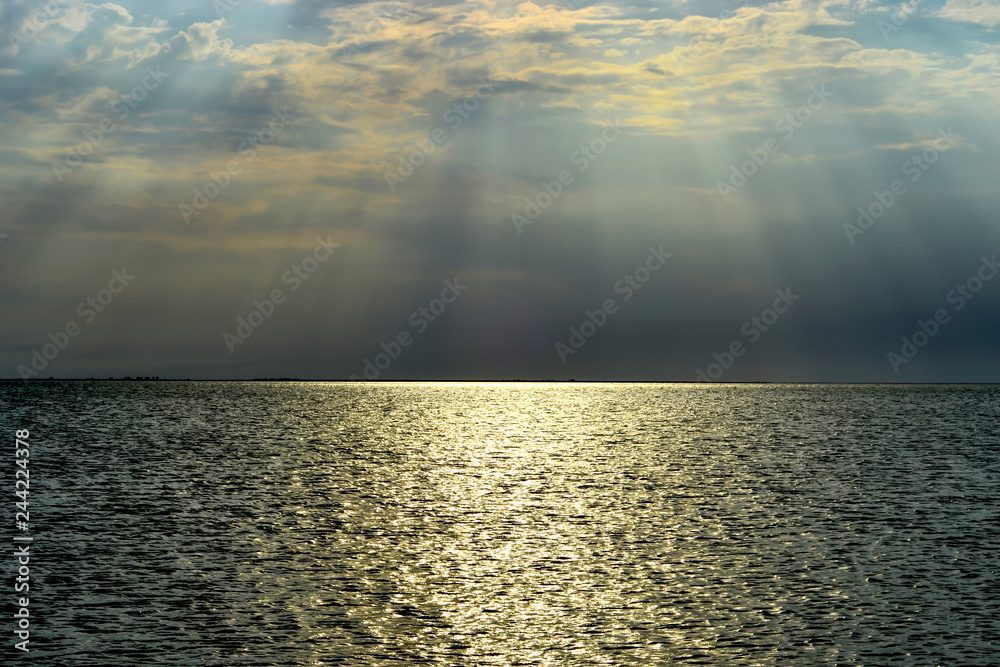 Landscape view of the setting sun over the sea. The photo was taken at Sivash in Ukraine Landscape view of the setting sun over the sea. The photo was taken at Sivash in Ukraine