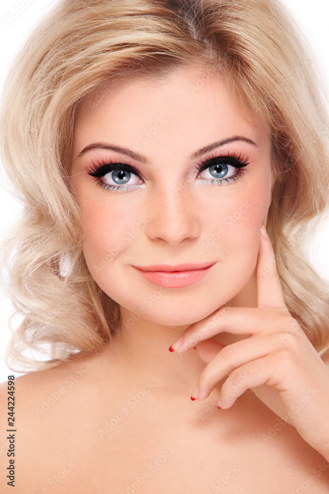 Portrait of young beautiful blonde girl with curly hair and winged eye make-up Portrait of young beautiful blonde girl with curly hair and winged eye make-up