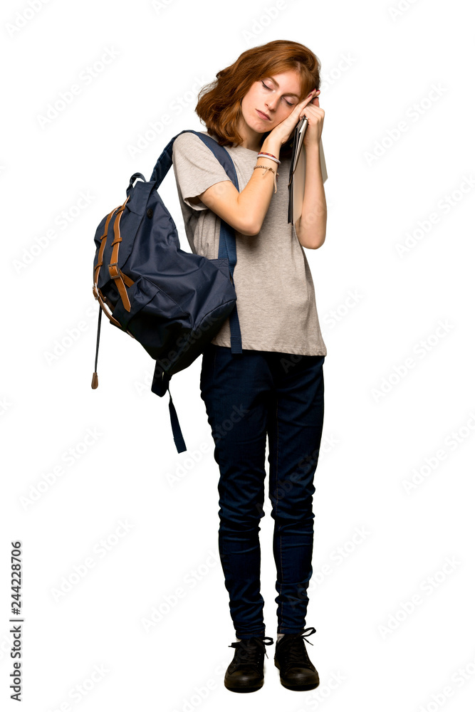 A full-length shot of a Young redhead student making sleep gesture in dorable expression over isolated white background A full-length shot of a Young redhead student making sleep gesture in dorable expression over isolated white background