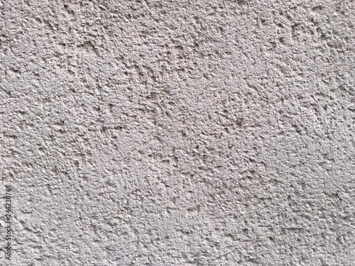 Rough bumpy white concrete texture background.