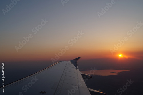 airplane wing against the sky  sunset