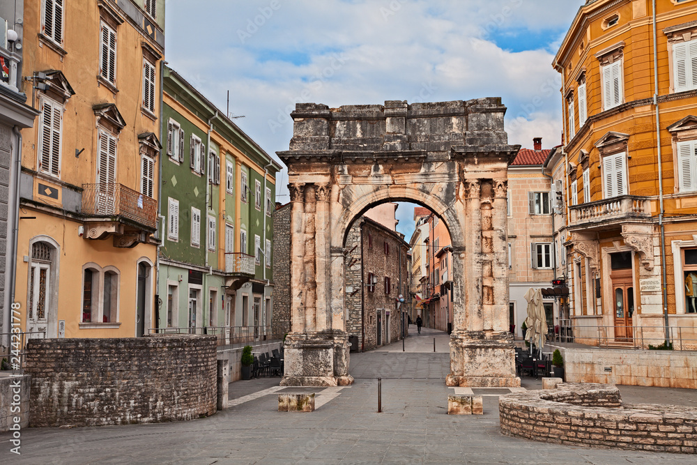Pula, Istria, Croatia: the ancient Roman Triumphal Arch of the Sergii