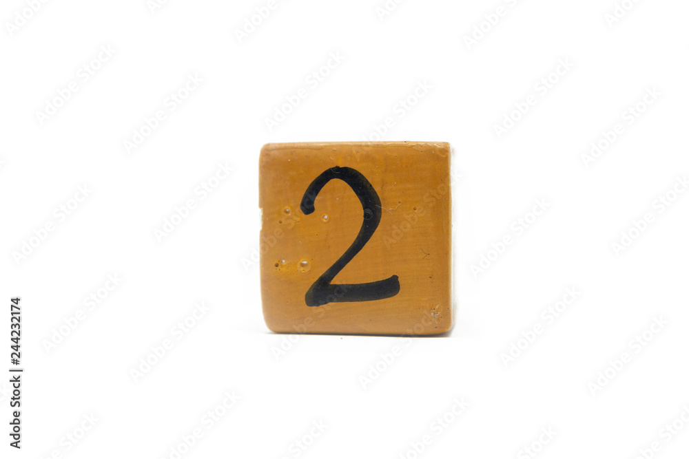Number two on cube of wooden material isolated on white background Number two on cube of wooden material isolated on white background