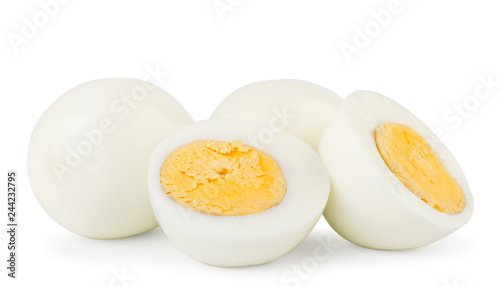 Boiled eggs and two halves close-up on a white. Isolated
