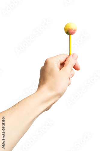 Lollipop in female hand isolated on white background. Alpha. Chupa Chups.