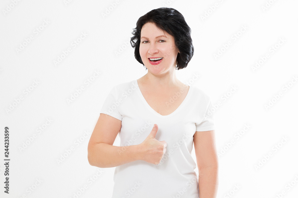 Middle age woman with perfect white teeth smile isolated on white background. Dental medicine and wrinkle skin care concept. Copy space. Big thumb up Middle age woman with perfect white teeth smile isolated on white background. Dental medicine and wrinkle skin care concept. Copy space. Big thumb up