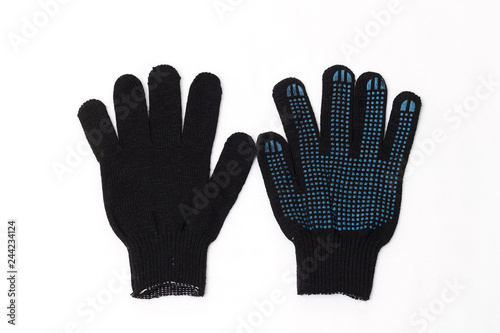Black knitted work gloves on a white background