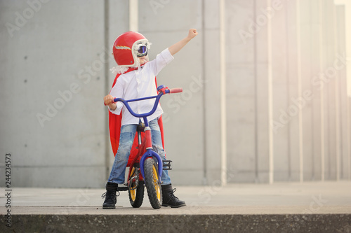 A funny, little superhero. Concept boy imagination. Happy childhood.