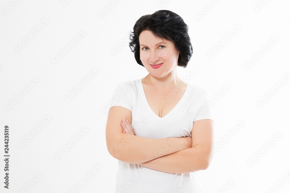 Happy middle age woman with crossed arms in summer blank template t shirt isolated on white background. Copy space. Happy middle age woman with crossed arms in summer blank template t shirt isolated on white background. Copy space.