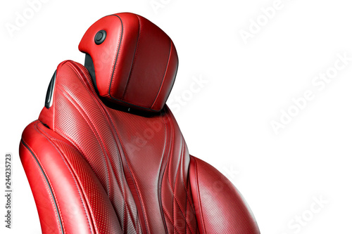 Red leather interior of the luxury modern car. Perforated red leather comfortable seats with stitching isolated on white background. Modern car interior details. Car detailing. Car inside