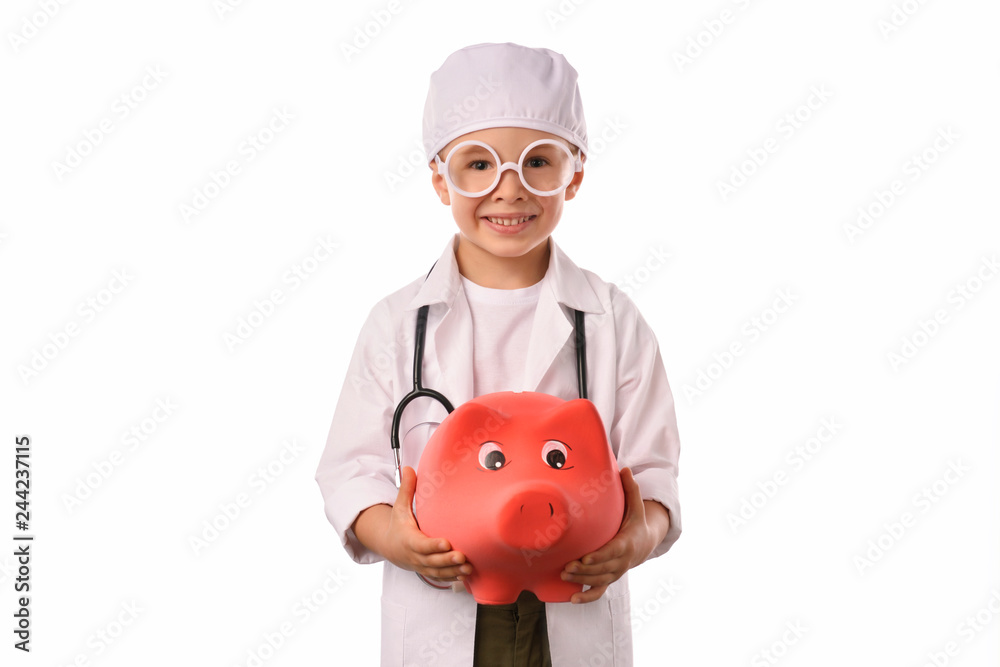 A little, smiling boy doctor in medical uniform, isolated on white, with stethoscope on the neck, reminds you about health care and healthy lifestyle. Waist up portrait, looking at camera. A little, smiling boy doctor in medical uniform, isolated on white, with stethoscope on the neck, reminds you about health care and healthy lifestyle. Waist up portrait, looking at camera.