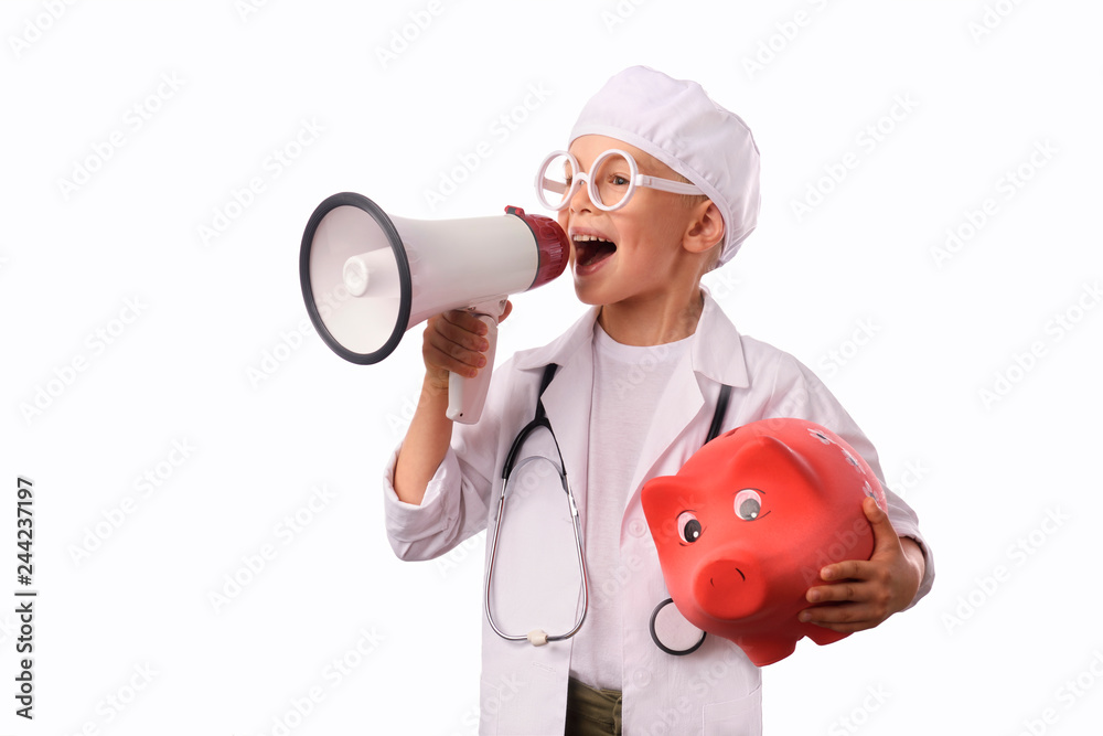 A little, smiling boy doctor in medical uniform, isolated on white, with stethoscope on the neck, reminds you about health care and healthy lifestyle. Waist up portrait, looking at camera. A little, smiling boy doctor in medical uniform, isolated on white, with stethoscope on the neck, reminds you about health care and healthy lifestyle. Waist up portrait, looking at camera.