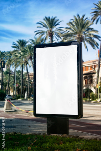 Mock up of blank white vertical light box with palm trees on island Palma de Mallorca in Spain photo