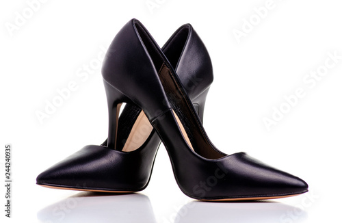 Female black leather high heels shoes on white background isolation