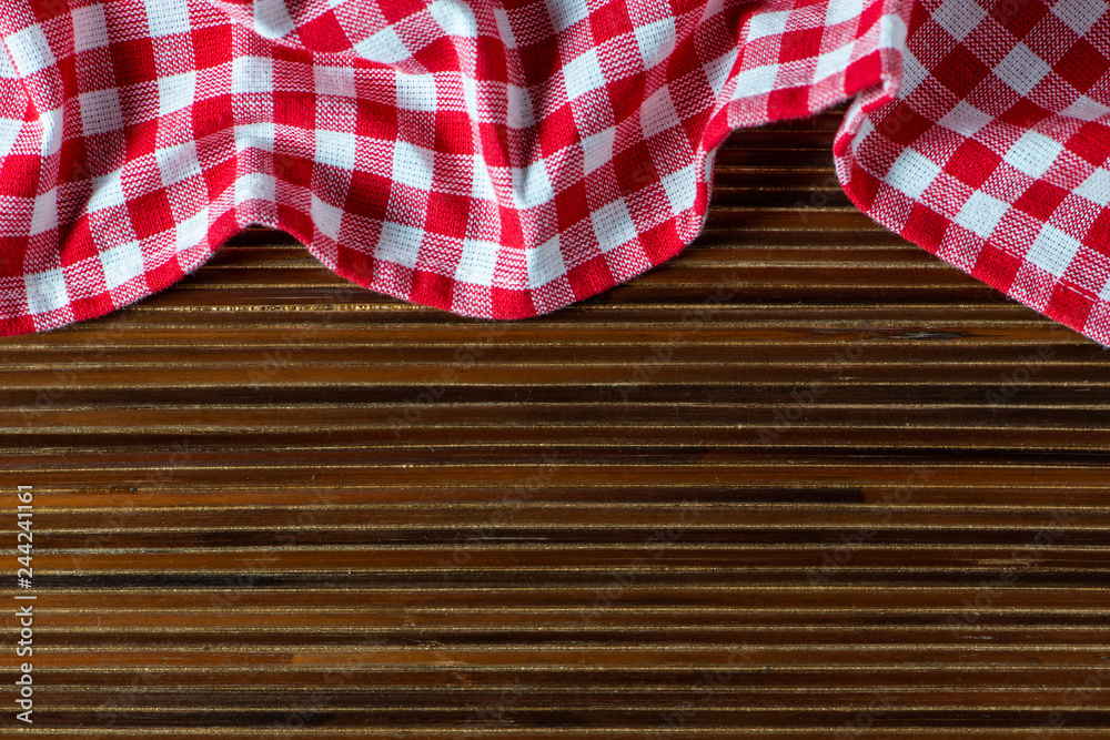 Obraz premium Cooking wooden table with kitchen towel or napkin. Top view with space for your meal or recipe 