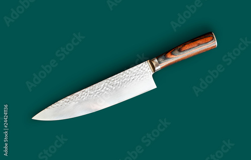 Chef's knife for your kitchen isolated on green