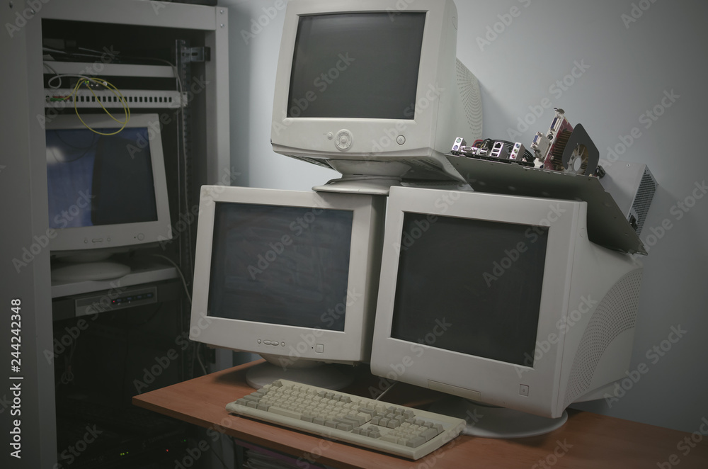 Blank screen computer monitors on the table in the server room. Blank screen computer monitors on the table in the server room.
