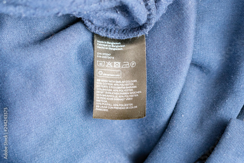 Obraz na płótnie close up brand new clothes instruction before washing