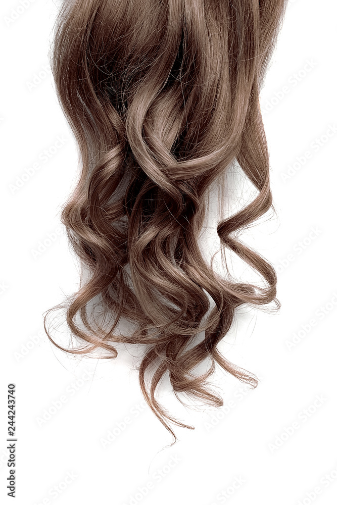 Naklejka premium Long wavy brown hair on white background