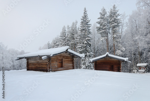 Two old wooden barns in North Russia © Vic