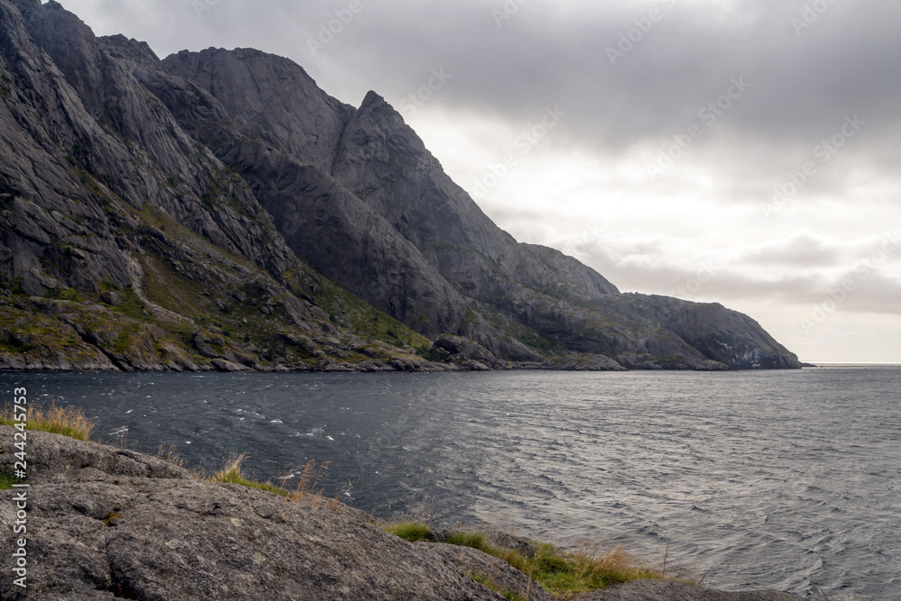 Mountains by the sea in Lofoten, Norway on a cloudy day