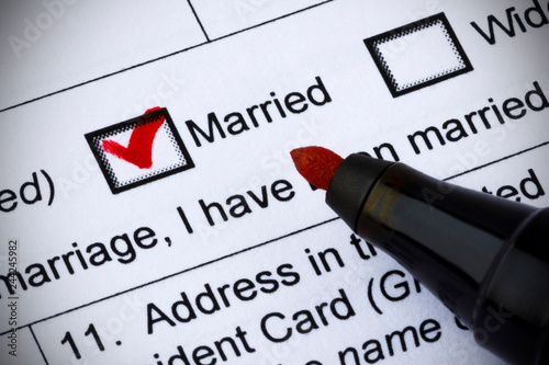 Family status - married. Question in the questionnaire. Red tick and pen