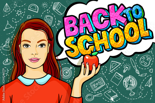 Young woman, teacher in front of a blackboard