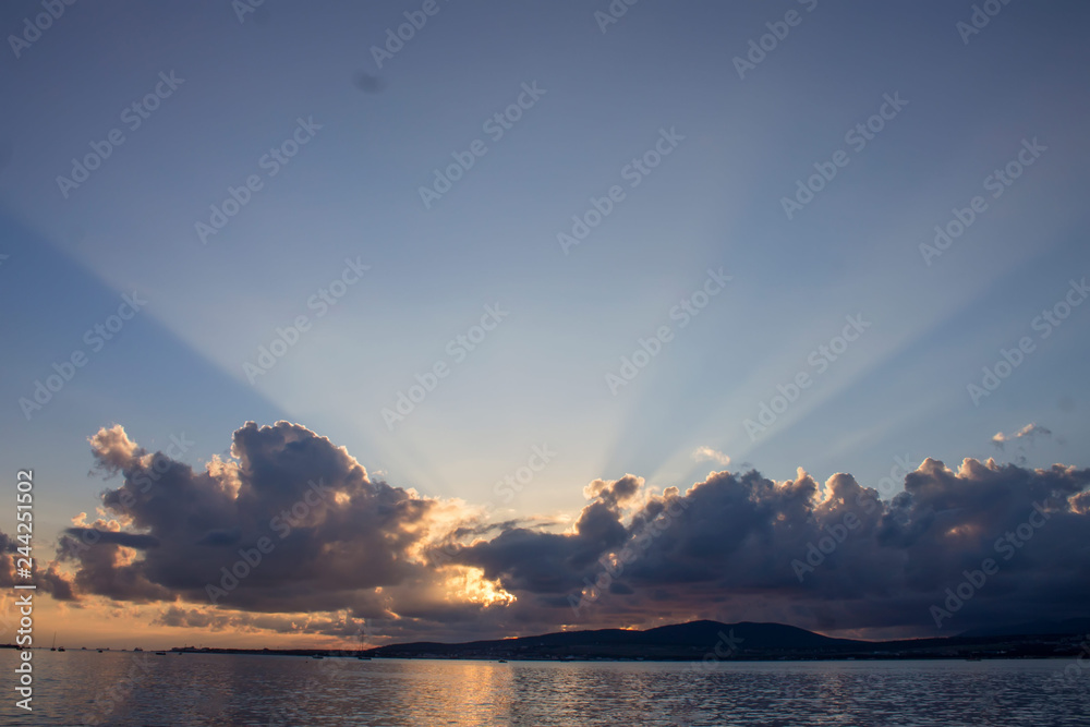 sunset rays over the sea sunset rays over the sea
