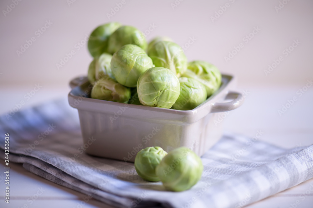 a pile of Brussels sprouts on a white background close up a pile of Brussels sprouts on a white background close up