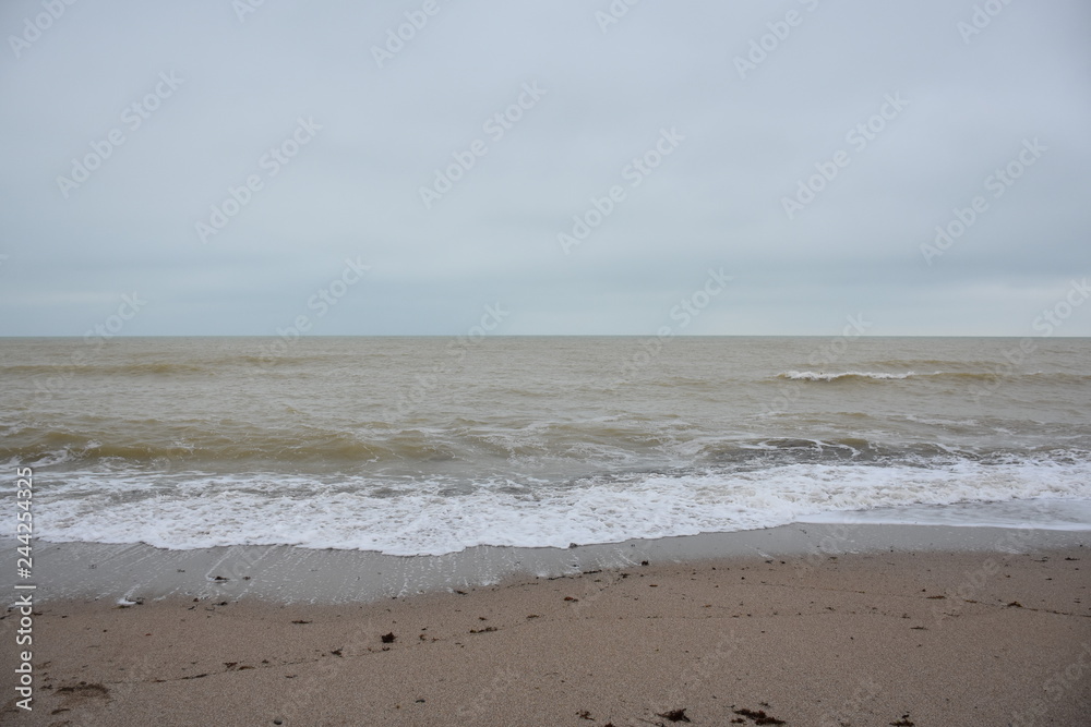 Winter sea and the beach in shades of creme brulee Winter sea and the beach in shades of creme brulee