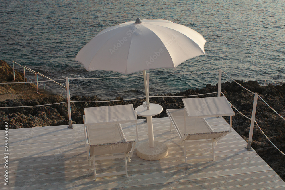 Parasol at sunset with seascape