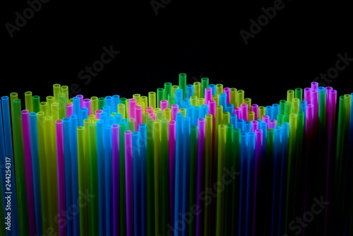 colored cocktail tubes on a dark background