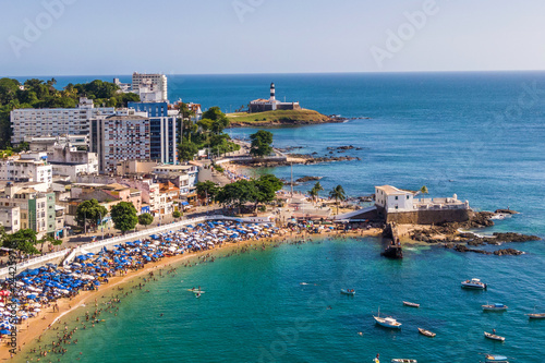 Aerial view of Salvador da Bahia, Brazil, showing Porto da Barra beach and historical landmarks Barra Lighthouse and Santa Maria Fort