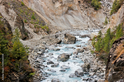 Wooden bridge over a small stream in Nepal